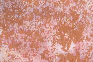 rusty pink orange cracked painted wall background texture, copy space