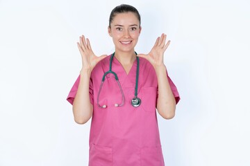 young caucasian doctor woman wearing pink uniform over white background crying and screaming. Human emotions, facial expression concept. Screaming, hate, rage.