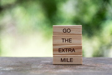 Wood block with text - Go the extra mile