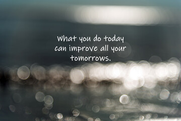 Blurry defocused light with inspirational text - what you do today can improve your tomorrow