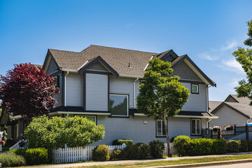 A perfect neighborhood. Houses in suburb at summer in the north America. Real Estate Exterior Front Houses. Big houses