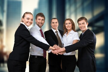 Group of smart young businesspeople in an office.