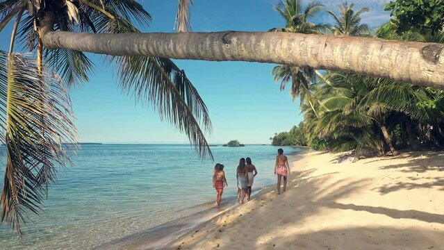Island, drone view and friends walking on beach for adventure, holiday and summer vacation in Mauritius. Traveling, relax and group of women by tropical ocean for outdoor break, journey and trip