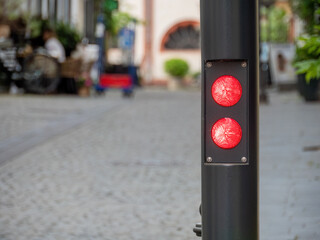 Red Warning Light of a Retractable Bollard at the Entrance to a Pedestrian Zone