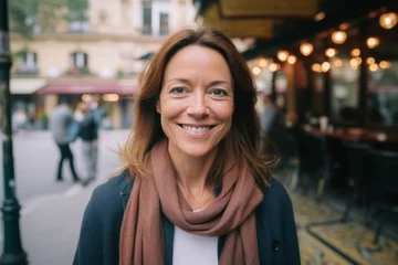Poster Close-up portrait photography of a grinning woman in her 40s that is wearing a chic cardigan against a parisian or european cafe background .  Generative AI © Eber Braun