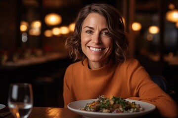 Medium shot portrait photography of a grinning woman in her 40s that is wearing a cozy sweater against a beautifully plated gourmet meal being served background .  Generative AI