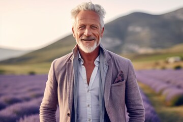 Portrait of a handsome senior man standing in a lavender field