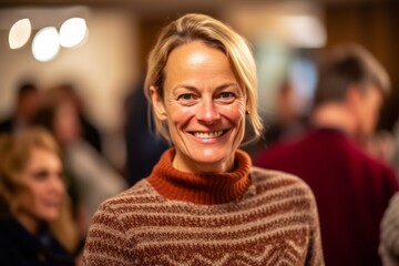 Obraz premium Medium shot portrait photography of a grinning woman in her 40s that is wearing a cozy sweater against a charity gala event with auction and celebrities background . Generative AI