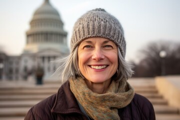 Portrait of a smiling mature woman in front of the US Capitol