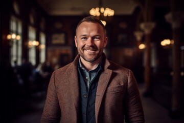 Obraz premium Portrait of a handsome man with a beard in a brown jacket
