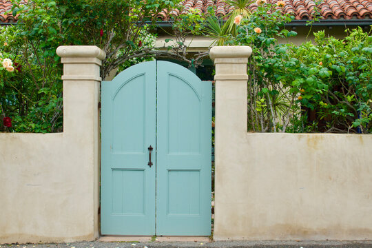 Aqua double doors with column supports at the garden entrance