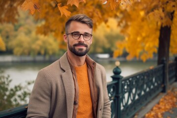 Medium shot portrait photography of a pleased man in his 30s that is wearing a chic cardigan against a picturesque city park during autumn foliage background .  Generative AI - obrazy, fototapety, plakaty