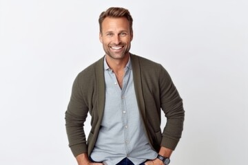 Fototapeta premium Medium shot portrait photography of a satisfied man in his 30s that is wearing a chic cardigan against a white background . Generative AI