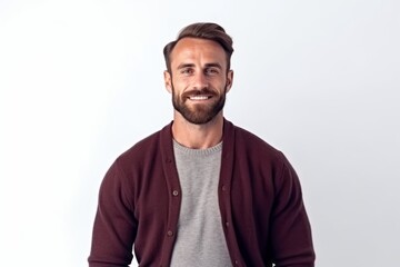 Fototapeta premium Medium shot portrait photography of a satisfied man in his 30s that is wearing a chic cardigan against a white background . Generative AI