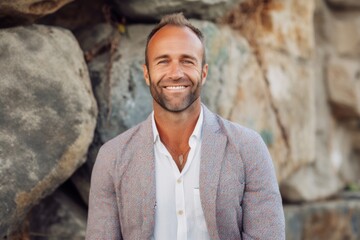 Portrait of a handsome middle-aged man smiling at the camera