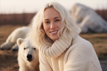 Portrait of a beautiful girl with a white dog in the autumn park.