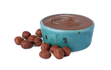 Bowl with delicious chocolate paste and hazelnuts on white background