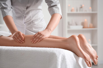 Obraz na płótnie Canvas Woman receiving leg massage in spa salon, closeup