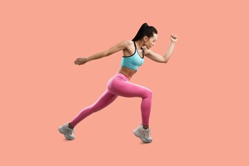 Fototapeta na wymiar Sporty young woman jumping, exercising
