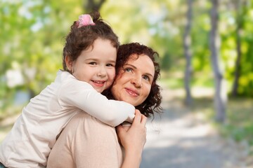 Fototapeta premium Young Mother with a small child, happy family outdoor.