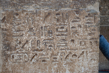 Hieroglyphic writing from the Pharaonic era inscribed on the wall of a pharaonic tomb in the Giza...