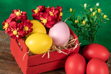 eggs in wooden box with hay on rustic background or surface, easter or holiday concept