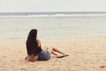 sea woman travel water freedom sand beach nature vacation sitting smile