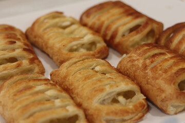 Apple Danish pastries on display in a store window.