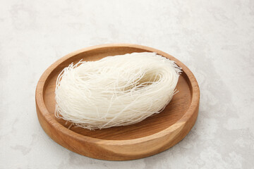 Vermicelli or Dry Glass Noodles served on wooden table.
