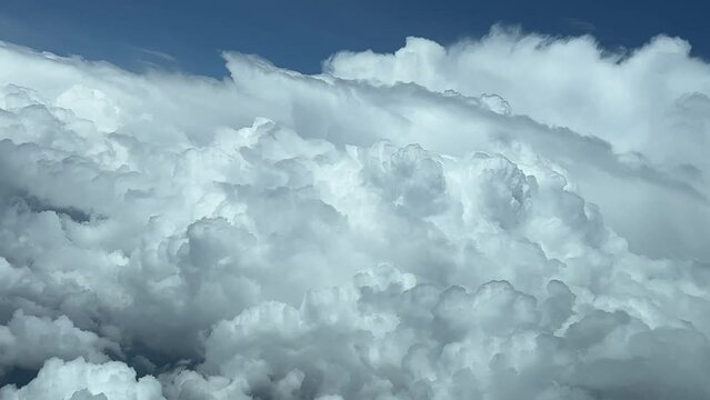 Huge storm clouds. A pilot&rsquo;s perspective while flying at 12000m hight during a left turn to avoid extreme dab weather ahead.