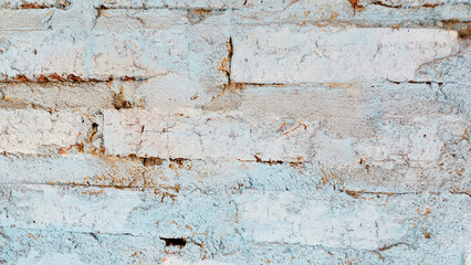 Bricks on the wall with blue paint on the bricks