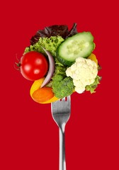 Tasty ripe green broccoli on fork