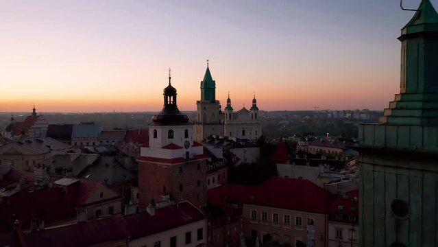 Aerial view of colorful tenement houses, town hall and town towers in Old Town (Downtown) in Lublin, Poland during beautiful morning with pastel colors and soft light.