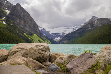 Lake Louise, Banff National Park, Alberta, Canada. Blurred background. Rocky Mountain lake landscape panorama without people - forest, scenic blue lake. 