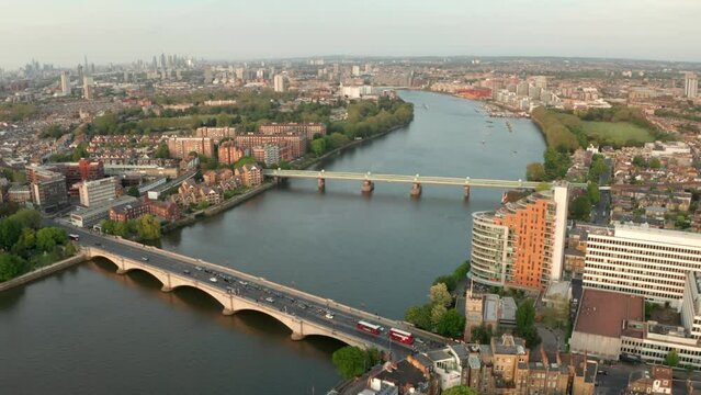 Aerial shot over Putney bridge with London skyline in the background