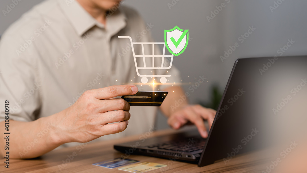 Poster a customer uses a laptop computer to register through a credit card to make online purchases. busine