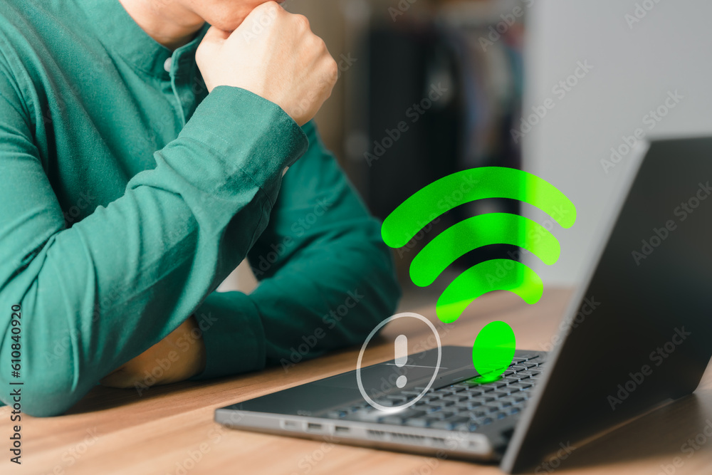 Poster Adult man using a computer laptop to connect to wifi in his home but wifi not working, and waiting to load digital game data from the website, concept technology of waiting to connect to wifi.