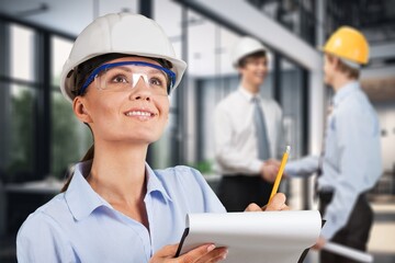 Young smart construction worker at work in office