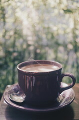 A cup of coffee to start the day with the warm rays of the morning sun, brewed using the Indonesian brewing method 