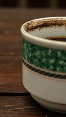 A cup of coffee to start the day with the warm rays of the morning sun, brewed using the Indonesian brewing method "Tubruk". plants and silhouettes
