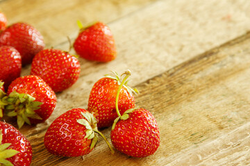 Fresh rustic ripe strawberries on wooden table