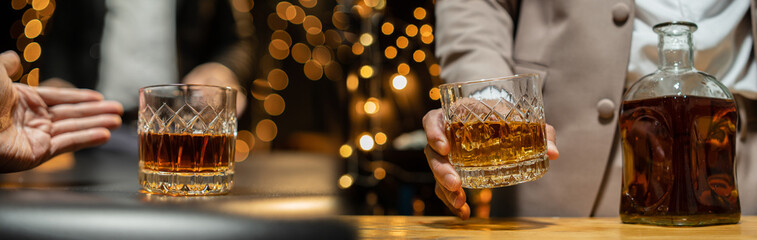  Barman pouring whiskey whiskey glass celebrate whiskey on a friendly party in  restaurant