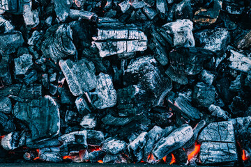 Background of burning hot coals. Burning coals in the brazier, barbecue grill