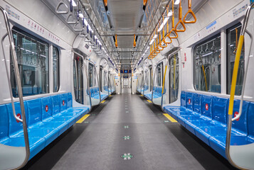 Fototapeta na wymiar Empty mas rapid transit train (MRT). Inside MRT carriage, a public municipal transport