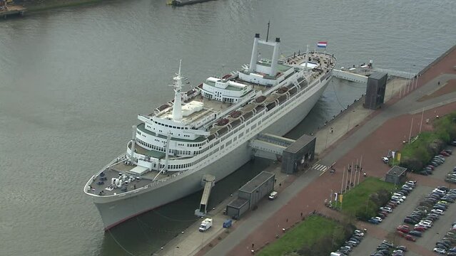 Aerial rotating shot with zoom out of the SS Rotterdam docked in port