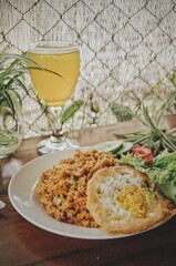 time to take a break for lunch, orange juice and eat fried rice and flour chicken and crushed with Indonesian chili sauce
