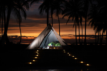 sunset on the beach in a beach tent