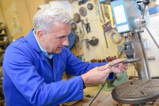 portrait of senior artisan in workshop