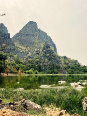 Luxurious mountain with vegetation next to a lake, Thakhek loop, Laos