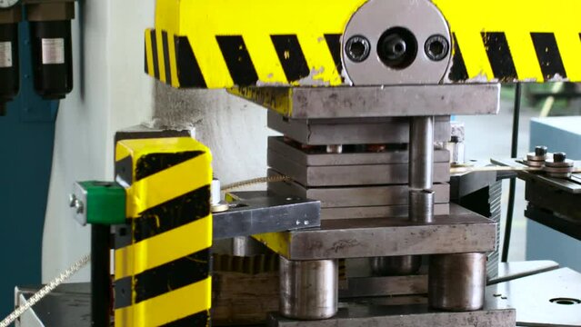 Hydraulic press automated machine in manufacturing industry.